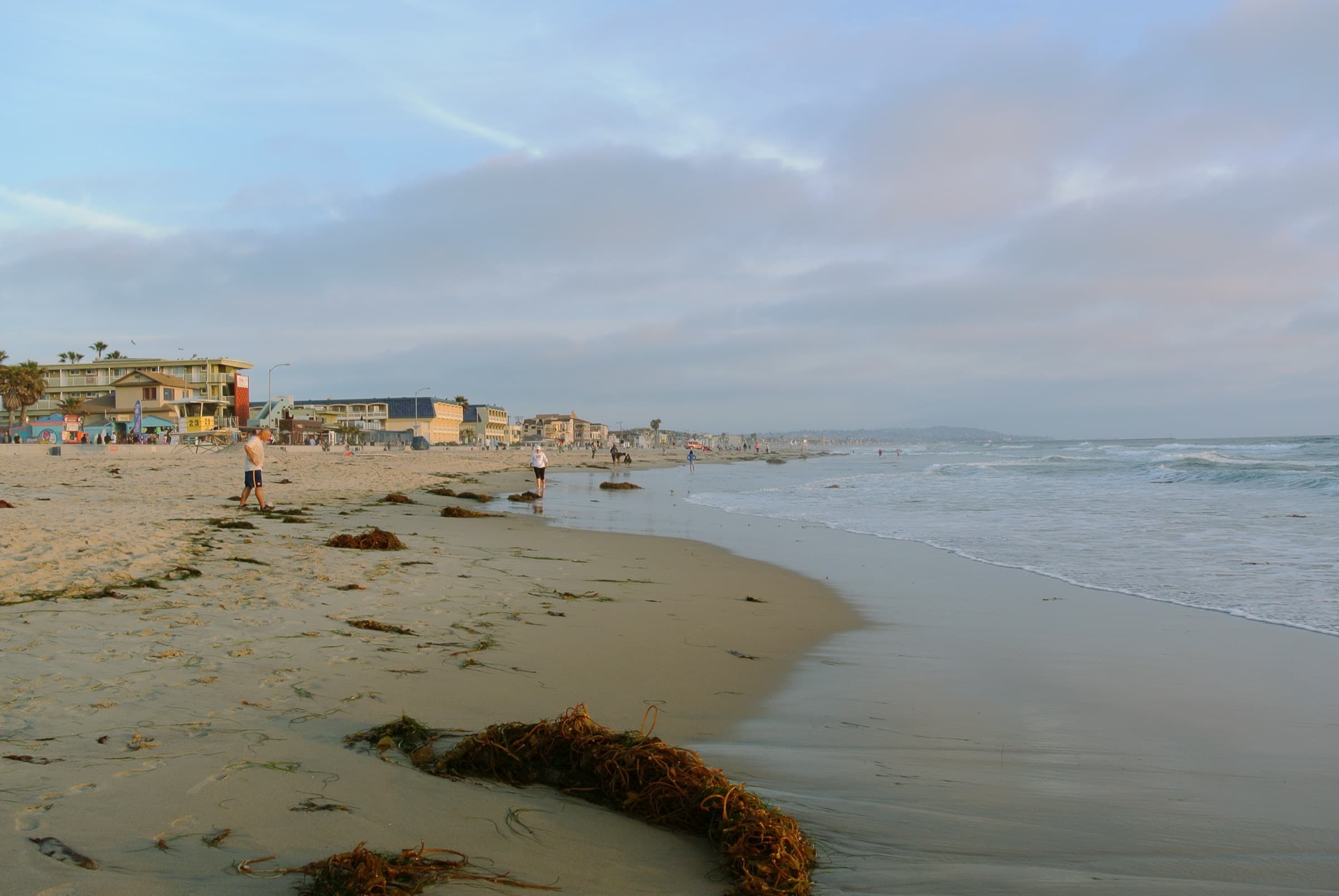 Pacific Beach coastline looking south along the boardwalk and surf