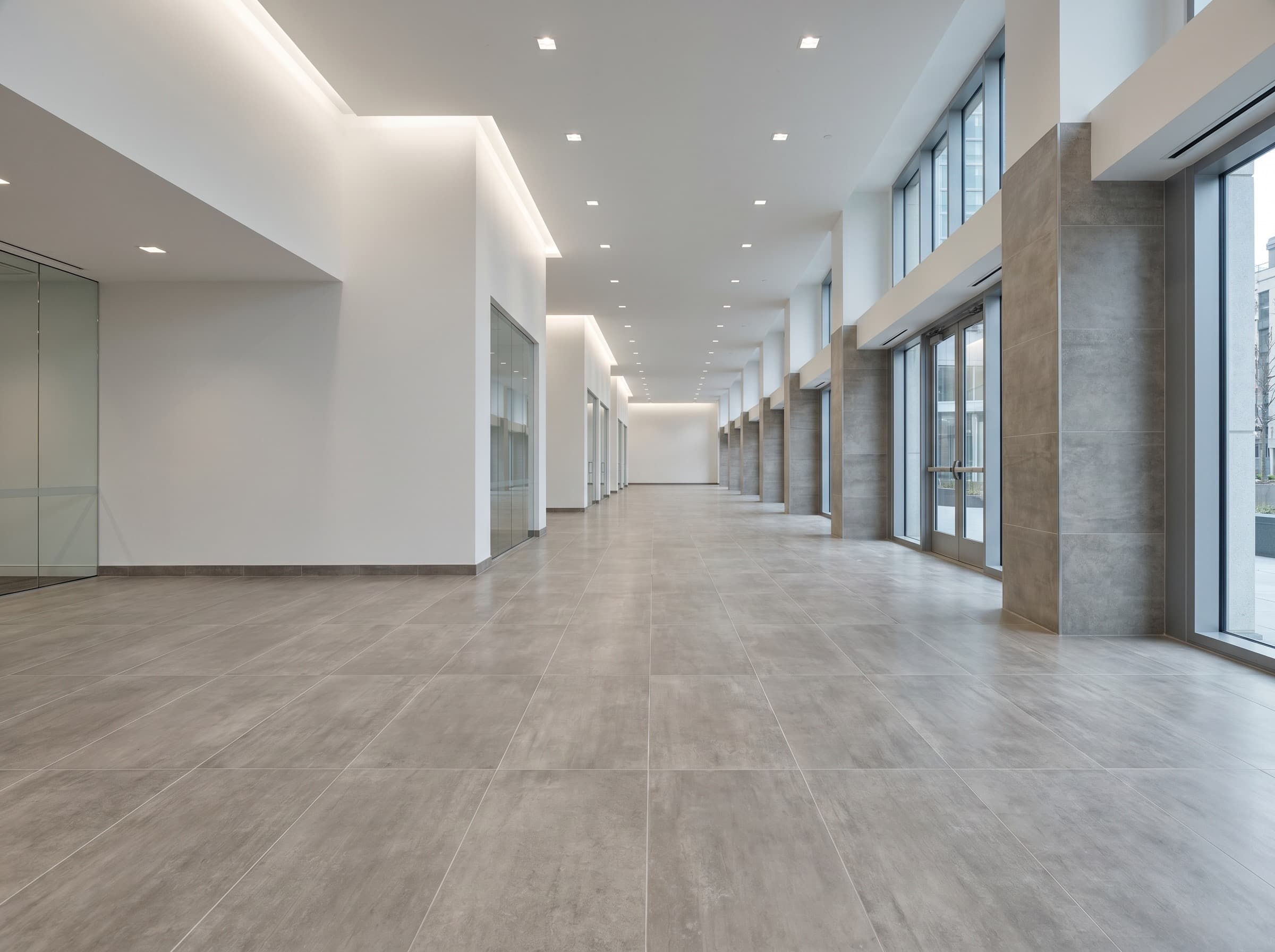 Commercial corridor with installed tile and clean finish detail