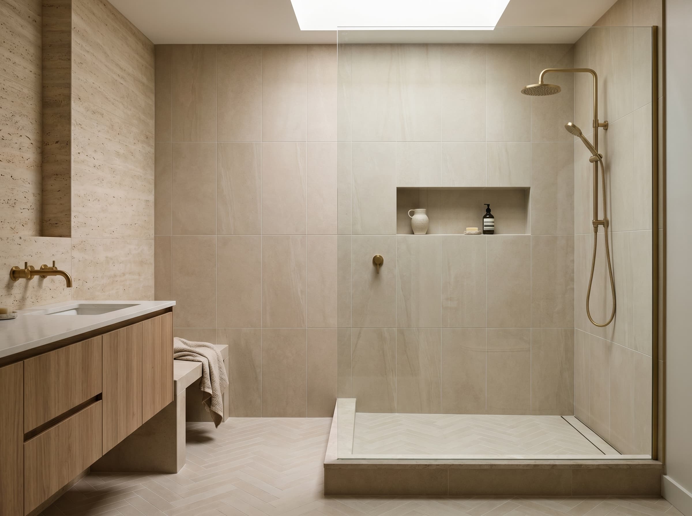 Finished bathroom with shower tile, vanity surface, and clean wall-to-floor transitions