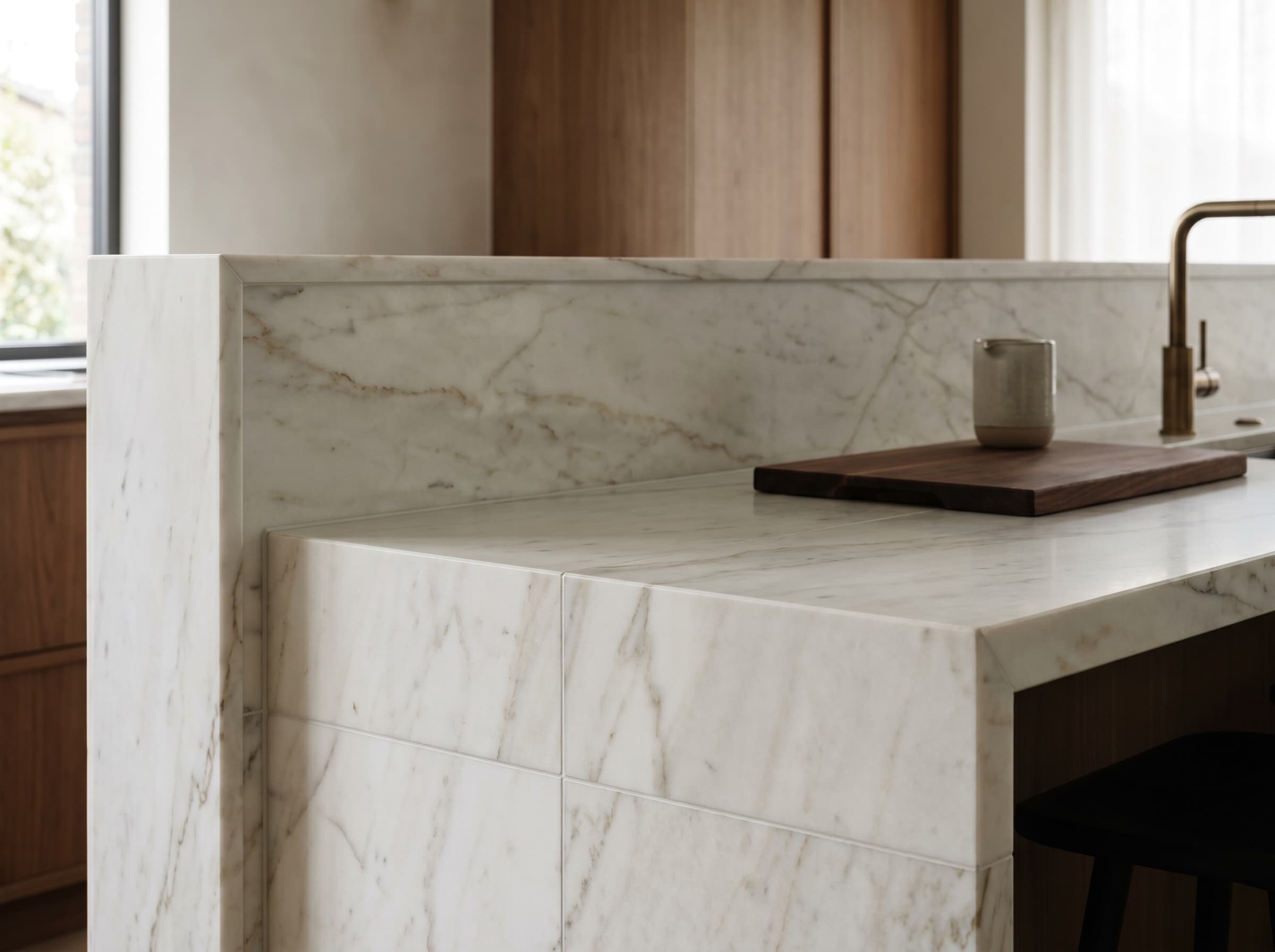 Clean countertop edge detail in a bright kitchen with coordinated tile backsplash